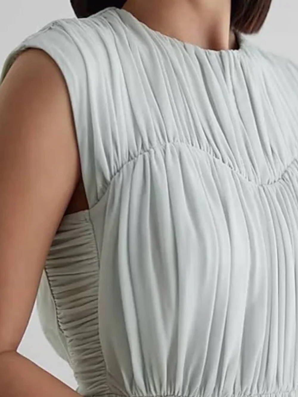 Express Pleated Peplum Sleeveless Blouse in Light Gray